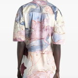 Tan shirt worn by a person, showing the shirt  fit