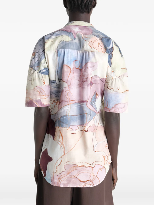Tan shirt worn by a person, showing the shirt  fit
