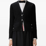 Black cardigan worn by a person, showing the cardigan's  fit