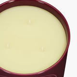 Close up of red candles, showing texture of the fabric
