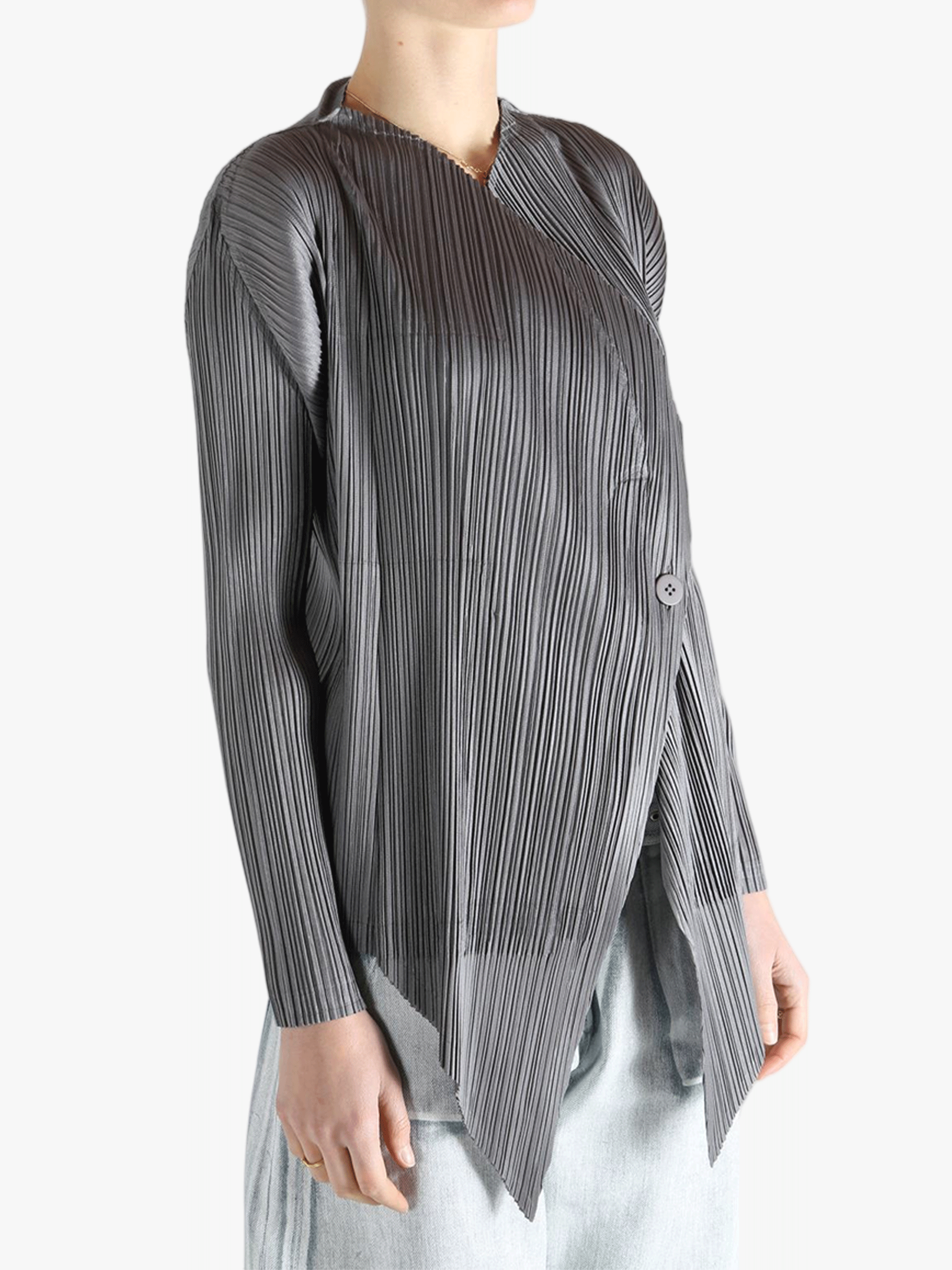 Grey cardigan worn by a person, showing the cardigan's fit