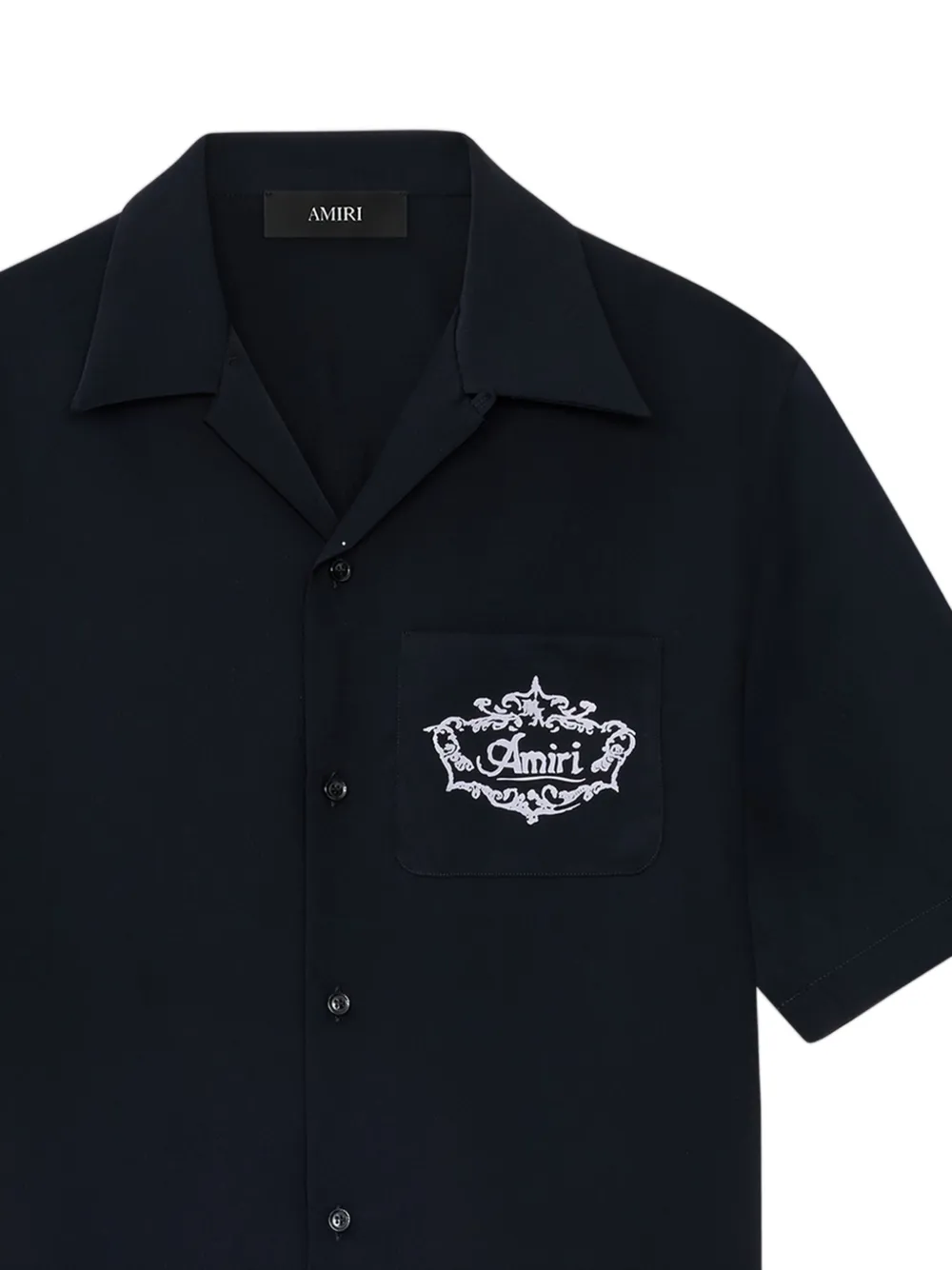 close up of black shirts, showing texture of the silk fabric