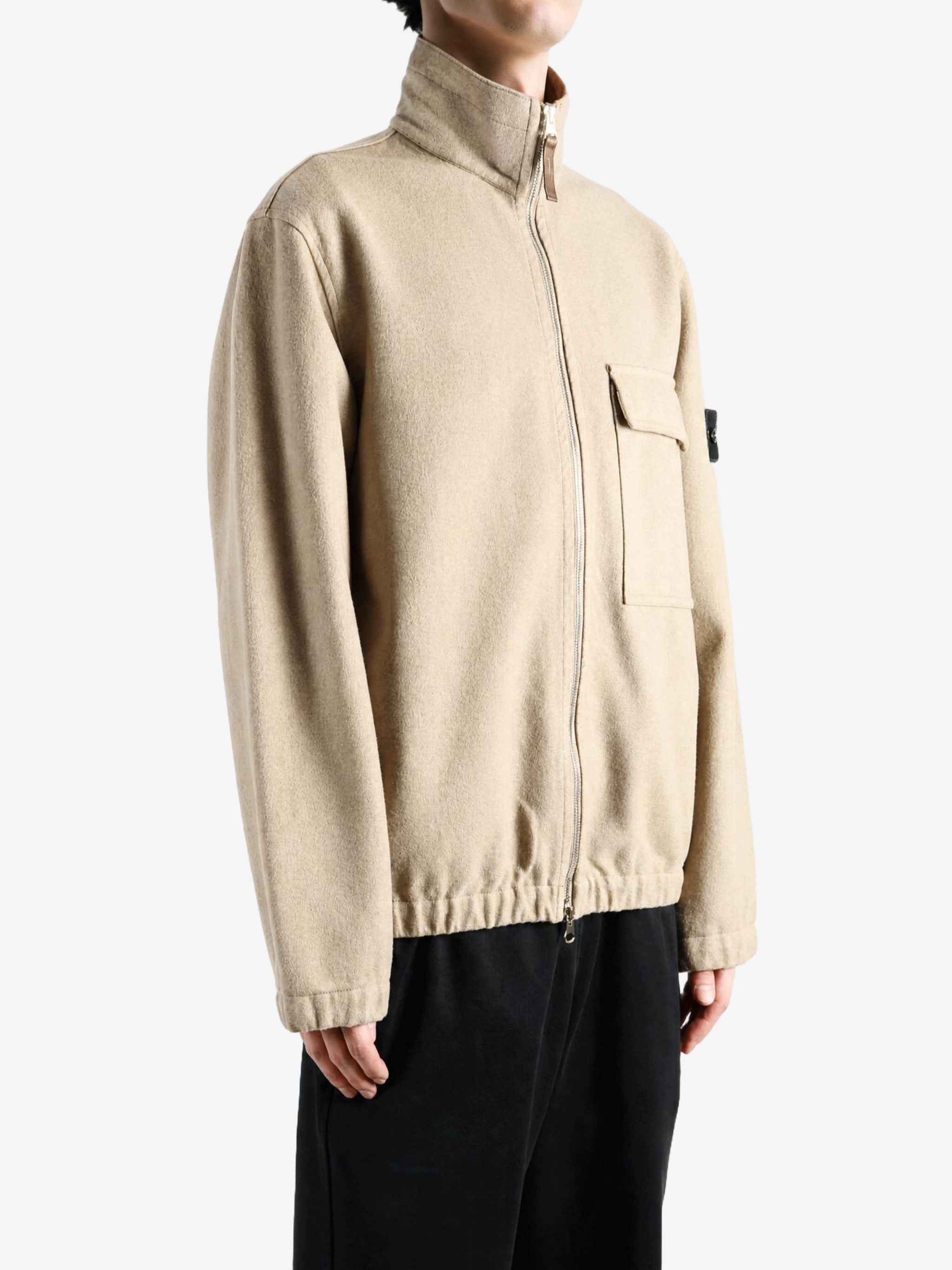 Tan shirt worn by a person, showing the shirt fit