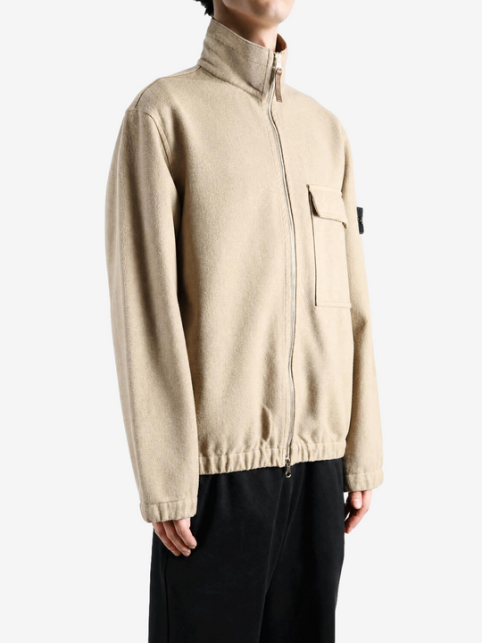 Tan shirt worn by a person, showing the shirt fit