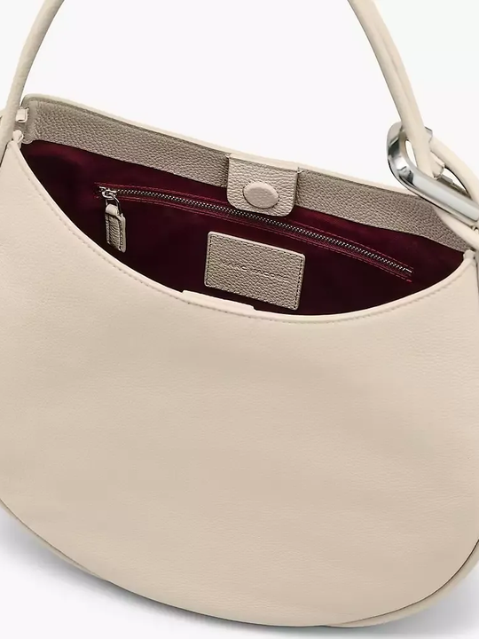 Close up of white bag, showing texture of the leather fabric