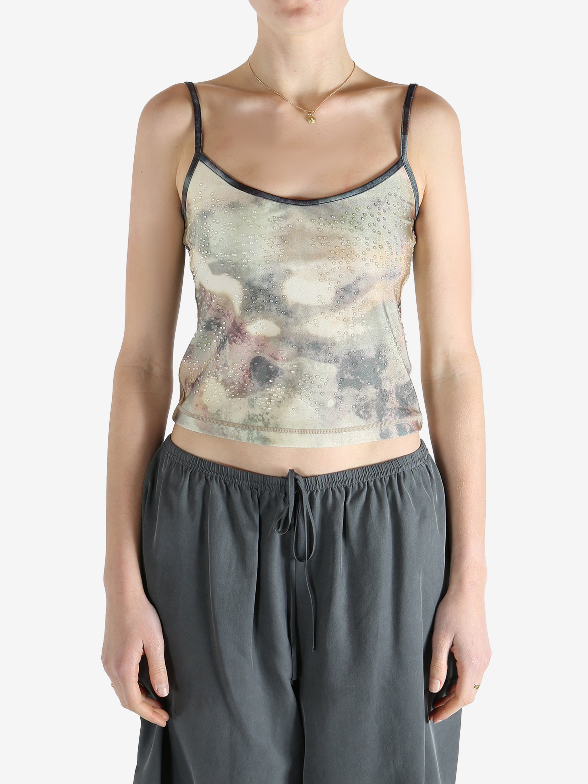 Grey top worn by a person, showing the fit