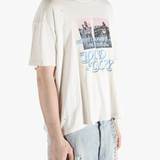 White t-shirt worn by a person, showing the shirt's fit