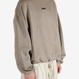 Tan tops worn by a person, showing the tops fit