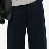 Close up of blue pants, showing texture of the cotton fabric