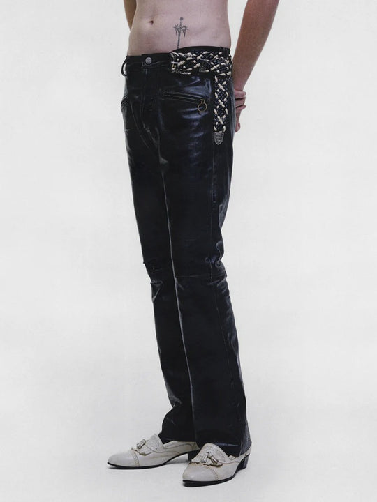 Black pants worn by a person, showing the pants fit