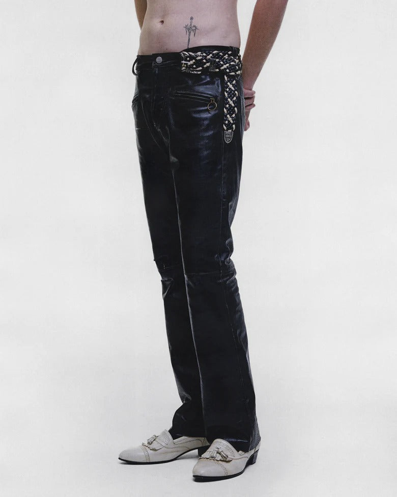 Black pants worn by a person, showing the pants fit