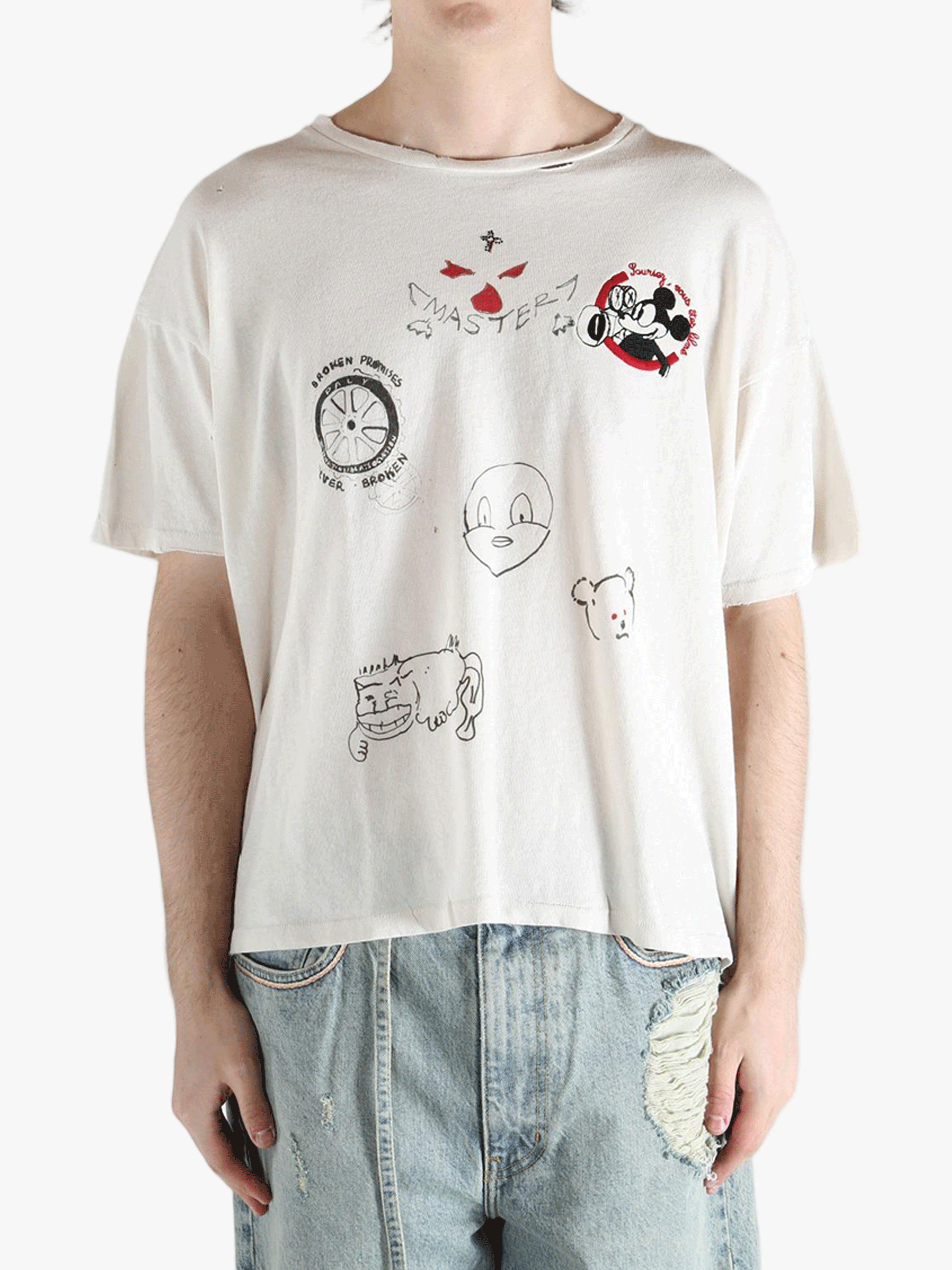 White t-shirt worn by a person, showing the shirt's fit