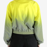 yellow jacket worn by a person, showing the jacket fit