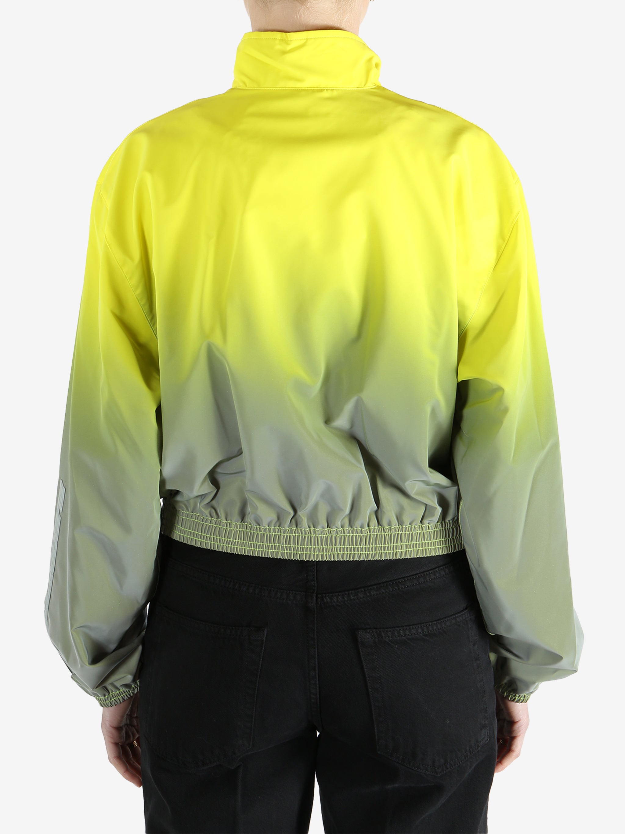 yellow jacket worn by a person, showing the jacket fit