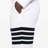 Close up of white pants, showing texture of the cotton fabric