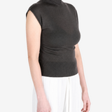 Brown top worn by a person, showing the top fit