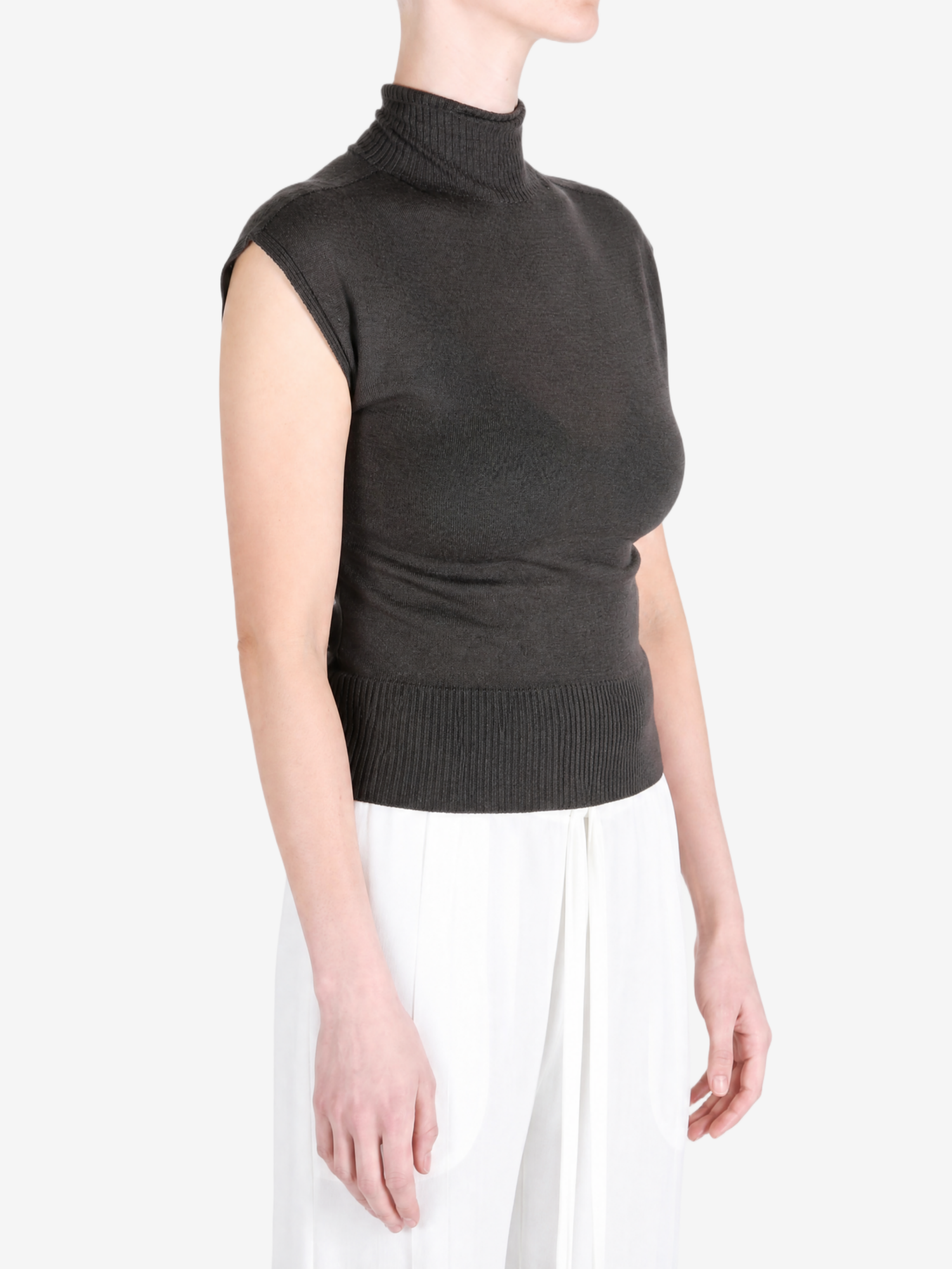Brown top worn by a person, showing the top fit