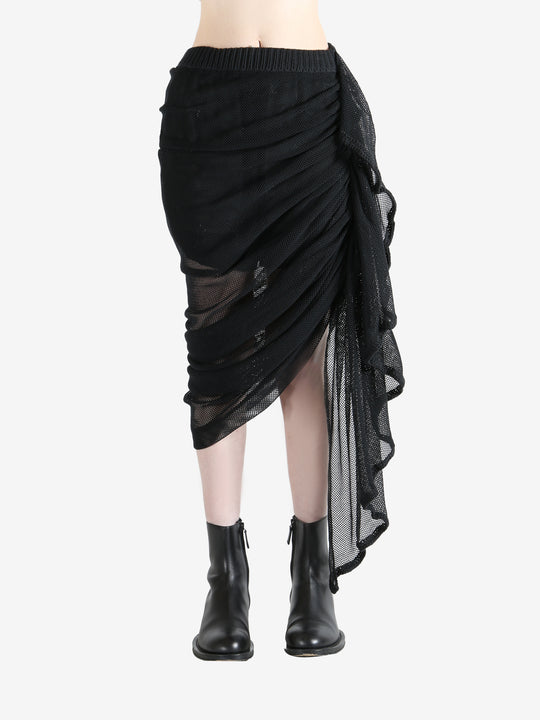 Black skirt worn by a person, showing the skirt fit