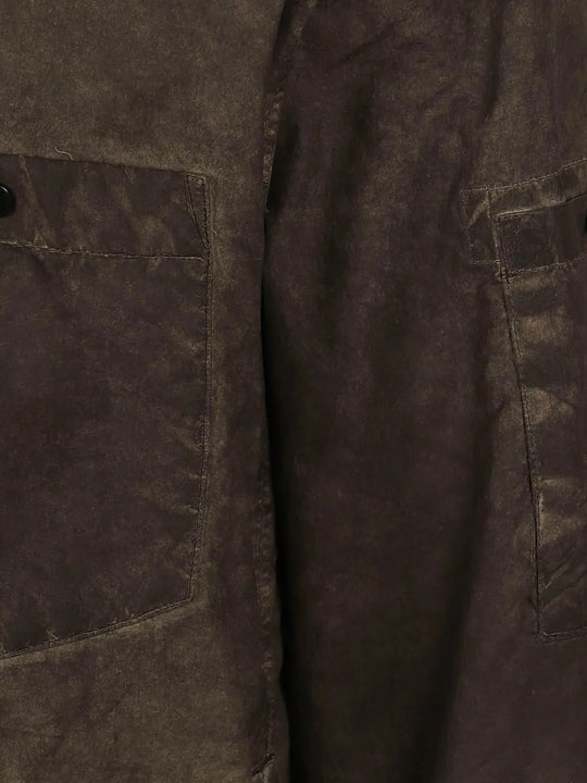 Close up of Brown shirt, showing texture of the 100% polyamide fabric