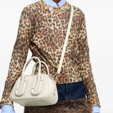 White bag worn by a person, showing the bag fit