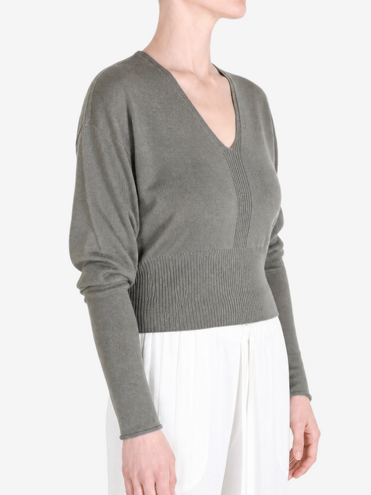 Grey top worn by a person, showing the top fit