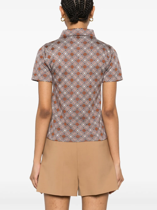 Brown shirt worn by a person, showing the shirt's fit