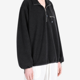 Black jacket worn by a person, showing the jacket fit