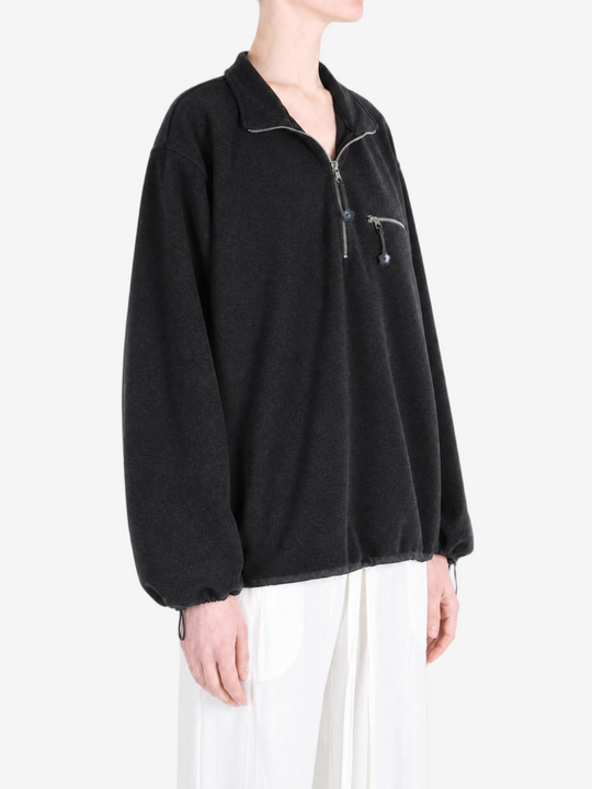 Black jacket worn by a person, showing the jacket fit