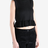 Black top worn by a person, showing the top's fit