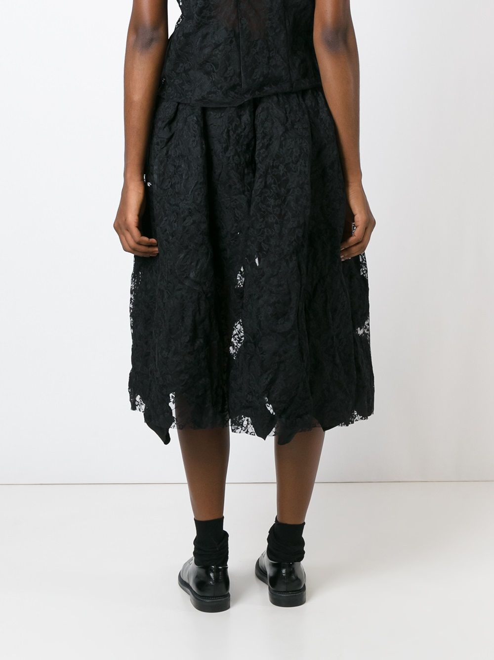 Black skirt worn by a person, showing the skirt fit