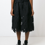 Black skirt worn by a person, showing the skirt fit