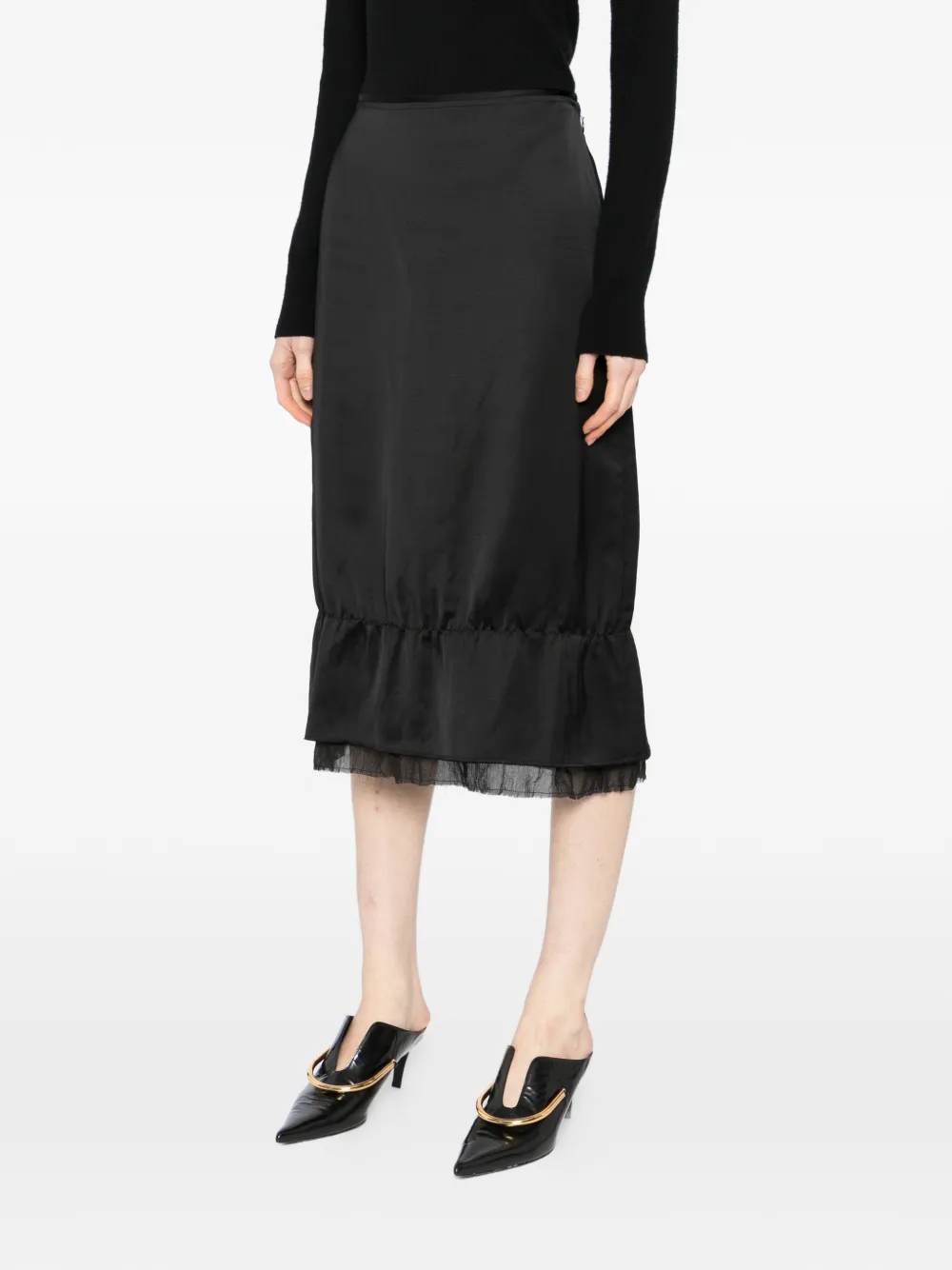 Black skirt worn by a person, showing the skirt's fit