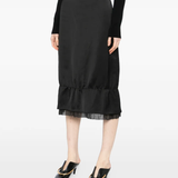 Black skirt worn by a person, showing the skirt's fit