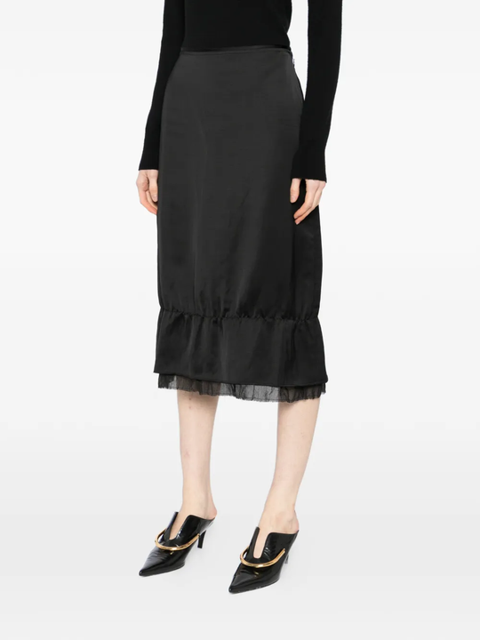 Black skirt worn by a person, showing the skirt's fit