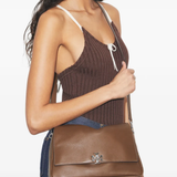 Brown bags worn by a person, showing the bags's fit