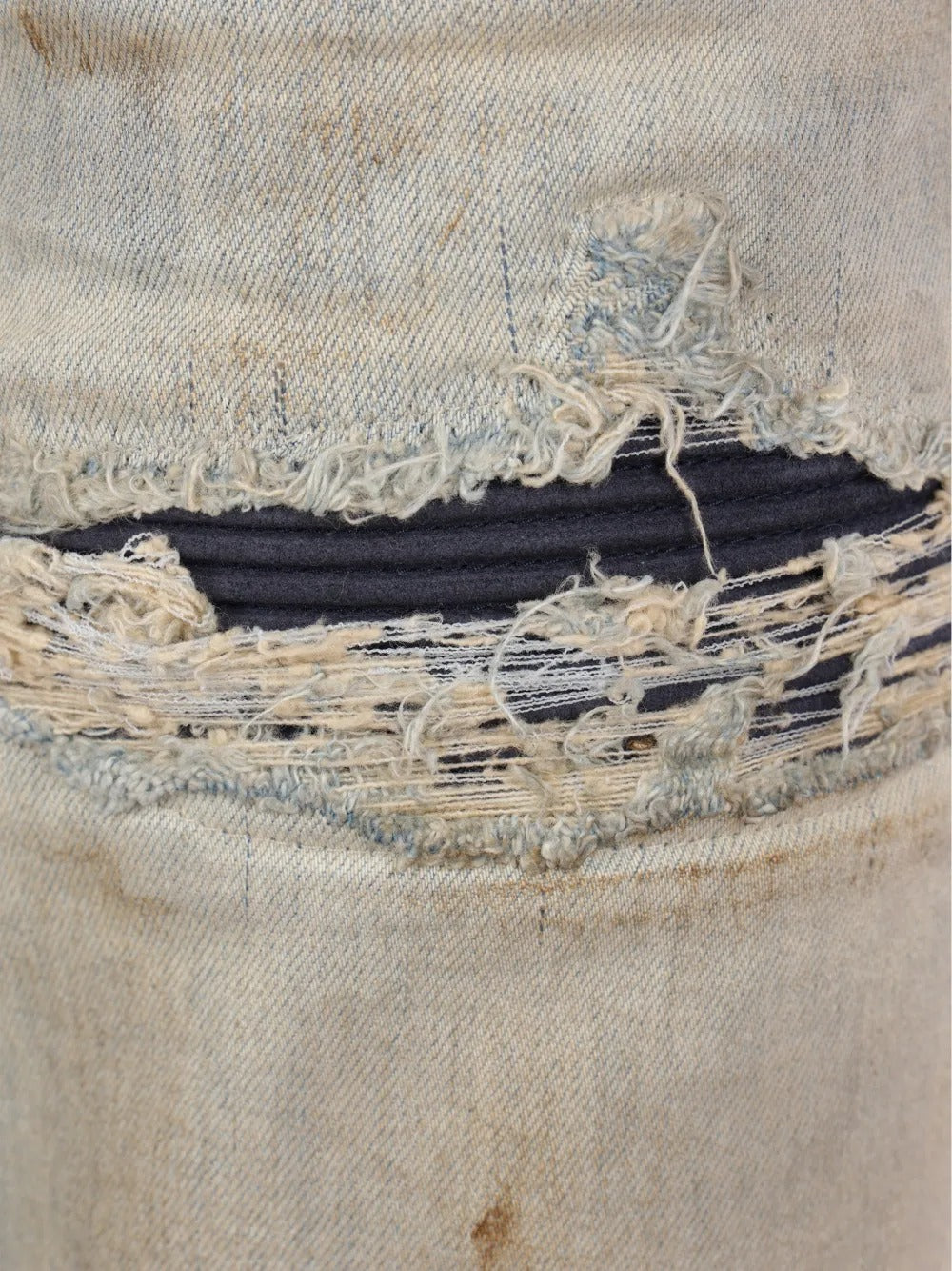 Close up of the blue jeans, showing texture of the cotton fabric