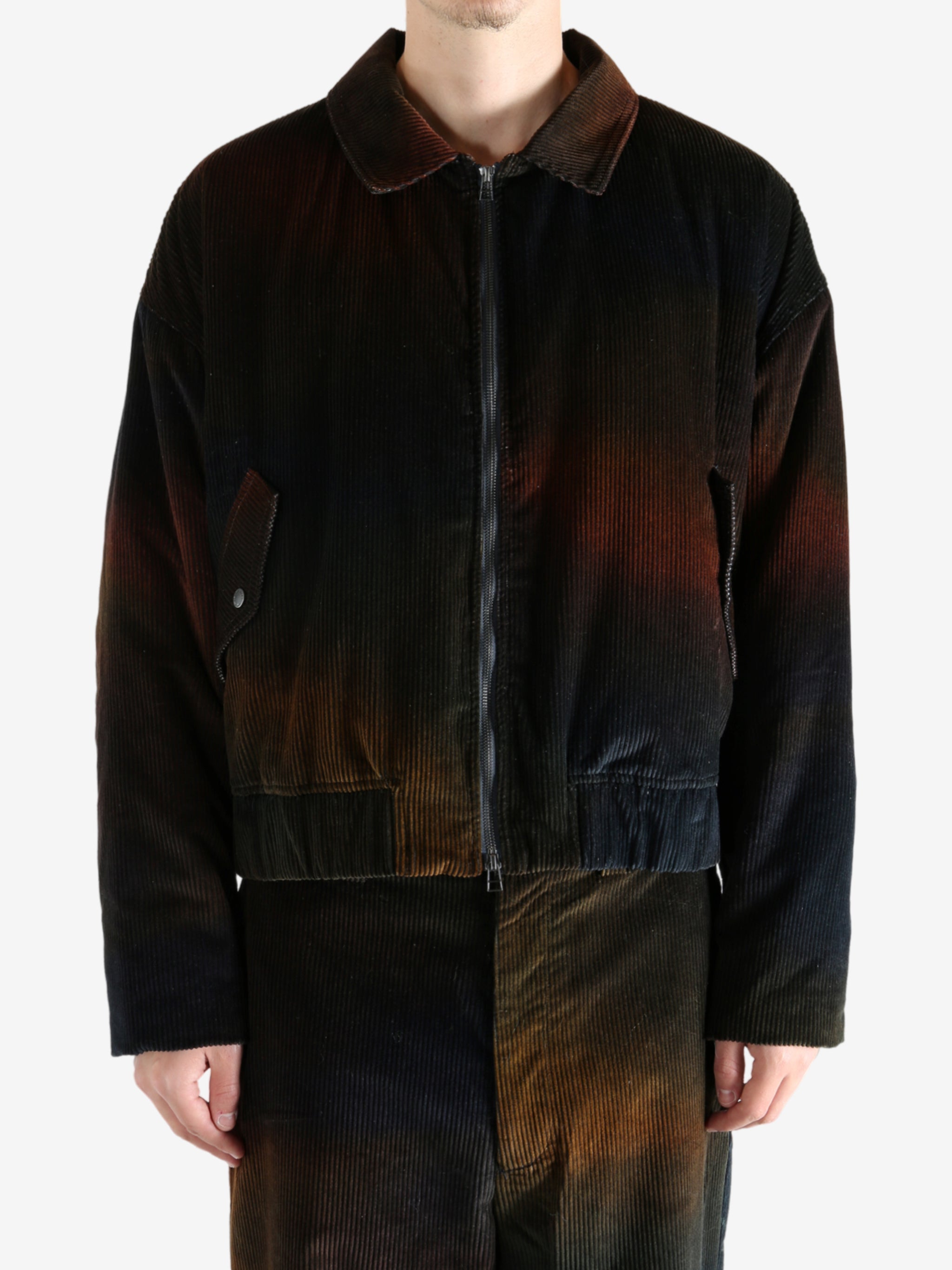 Black jacket worn by a person, showing the jacket's fit