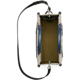 Close up of navy bag, showing texture of the  fabric