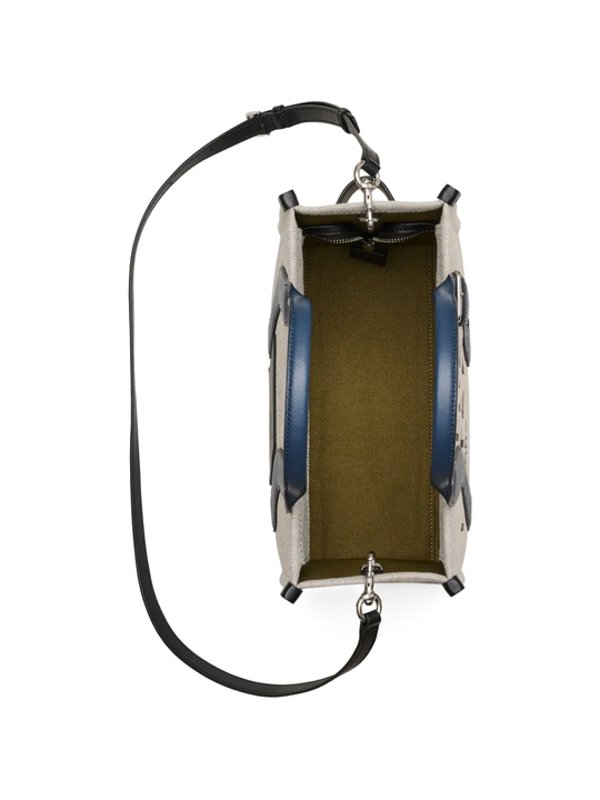 Close up of navy bag, showing texture of the  fabric