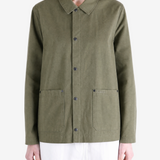 Green jacket worn by a person, showing the jacket fit