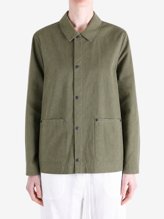 Green jacket worn by a person, showing the jacket fit