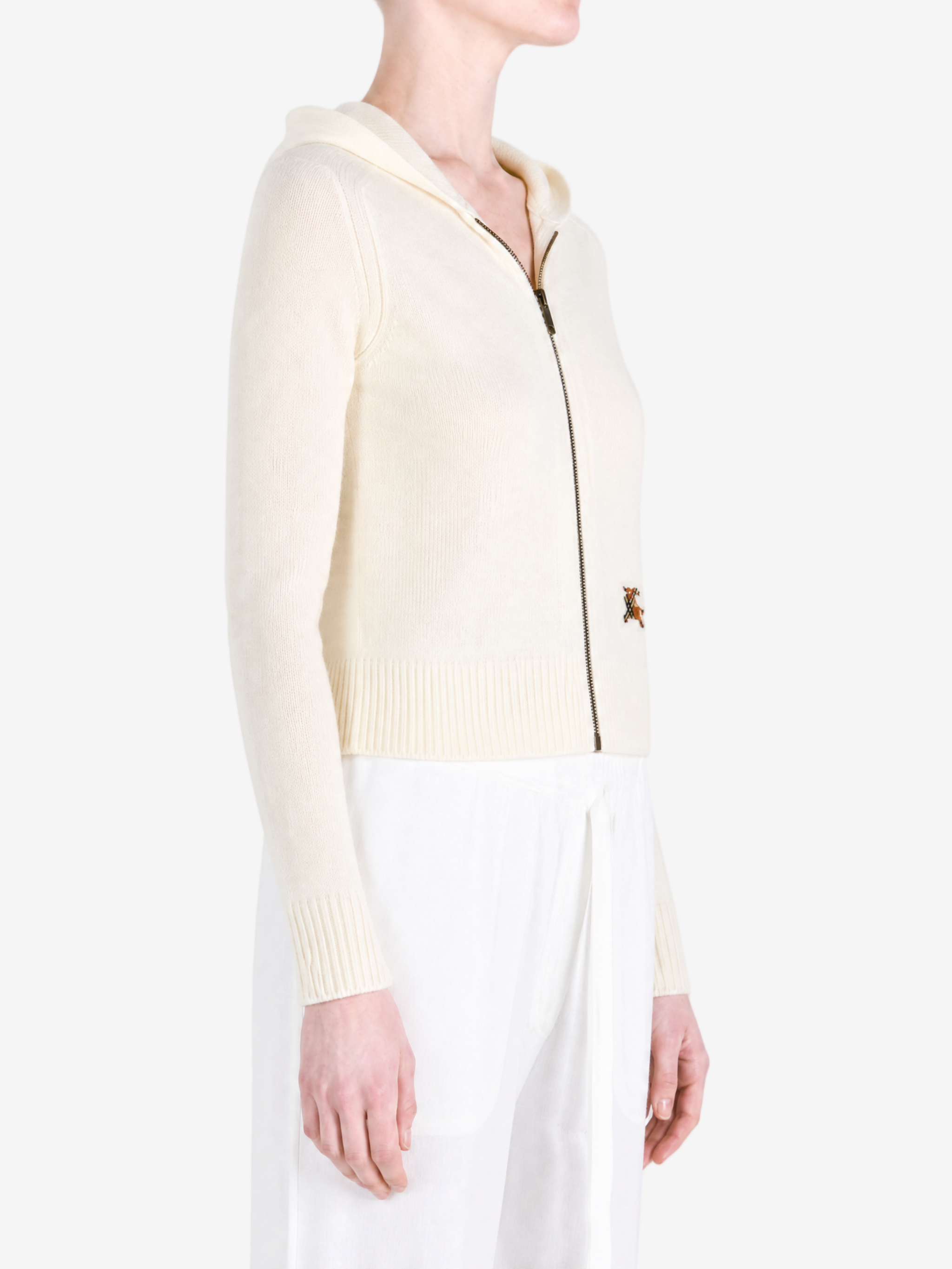 White jacket worn by a person, showing the jacket fit