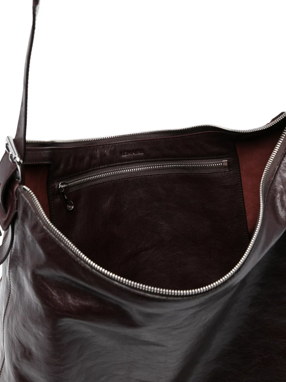 close up of brown bags, showing texture of the leather  fabric