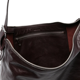 close up of brown bags, showing texture of the leather  fabric