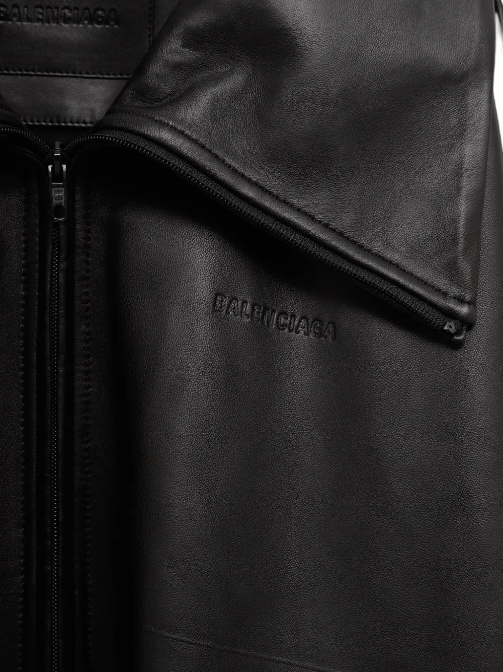 Close up of Black jacket, showing texture of the 100% calf leather made fabric