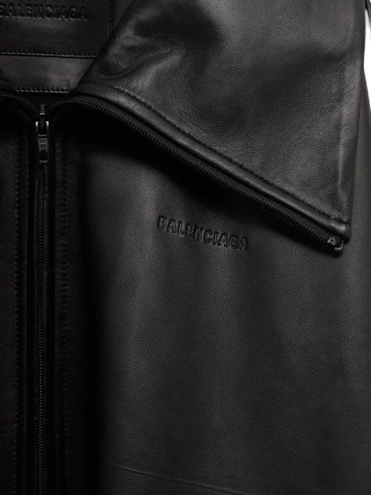 Close up of Black jacket, showing texture of the 100% calf leather made fabric