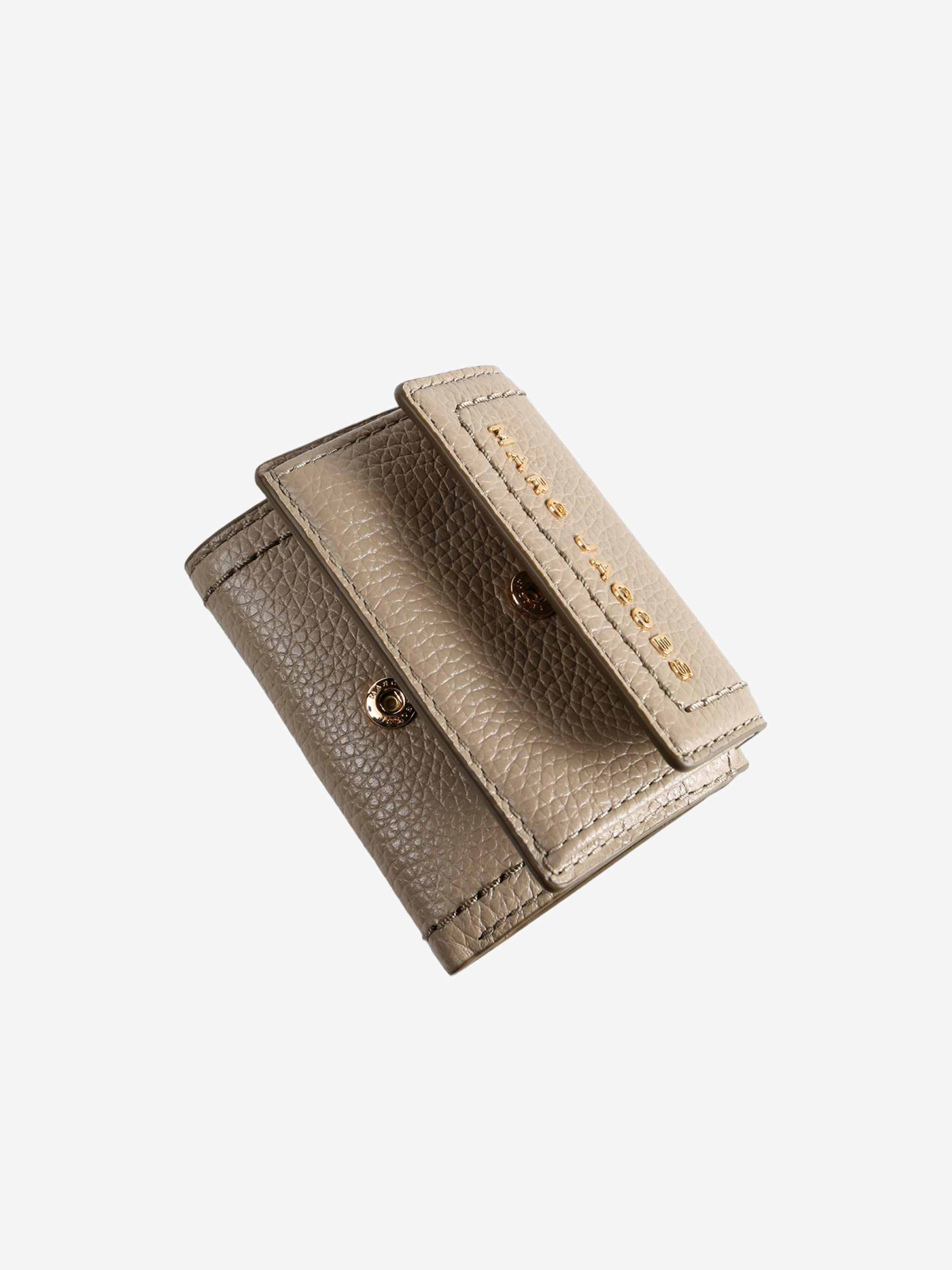 Close up of tan bag, showing texture of the cow leather fabric