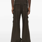 Brown pants worn by a person, showing the pants' fit