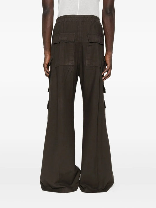 Brown pants worn by a person, showing the pants' fit