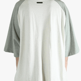 White t-shirt worn by a person, showing the shirt's fit